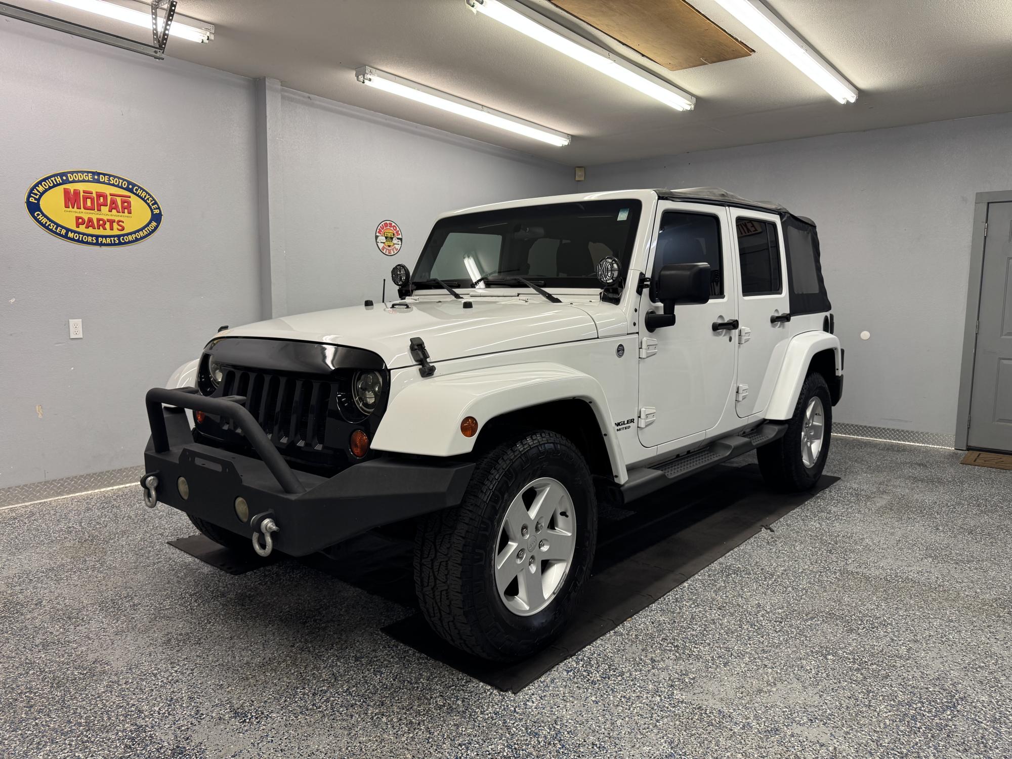 photo of 2012 Jeep Wrangler Unlimited Sahara 4WD Extra Clean!!!